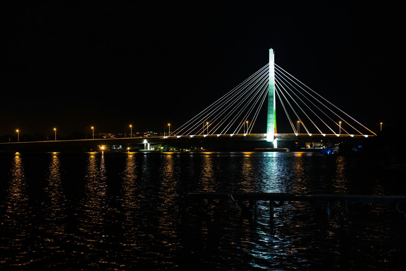 The Lekki-Ikoyi Link Bridge lit up over the water at night in Lagos